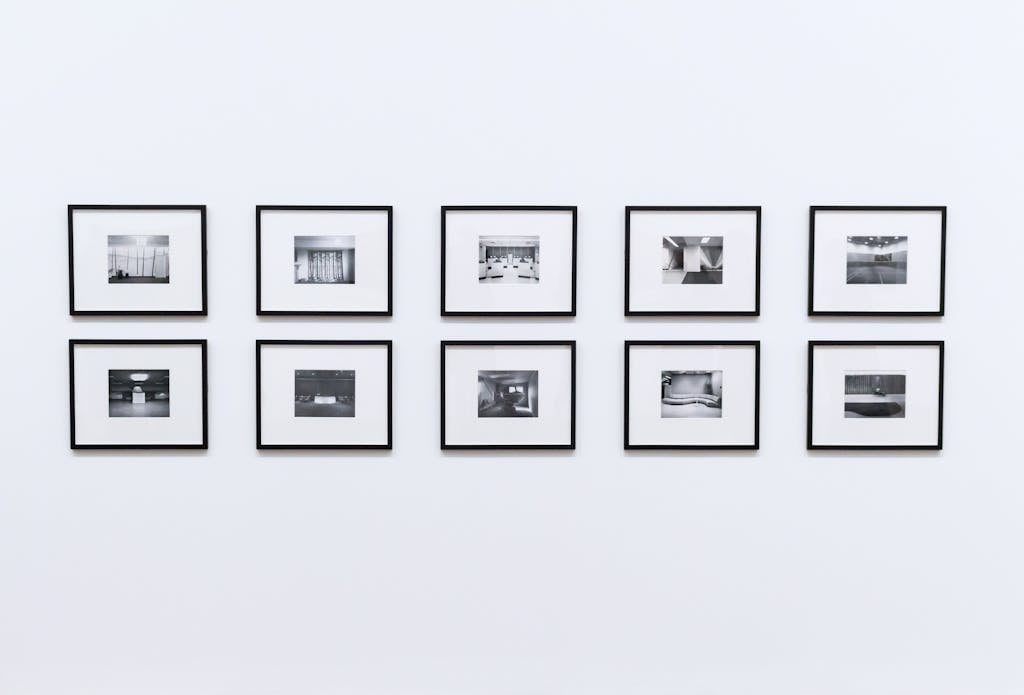 Simple and elegant wall display with black and white framed photographs in a modern interior.
